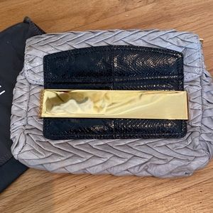Jimmy Choo Pleated Leather Clutch.